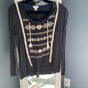 Small navy and beige shirt.